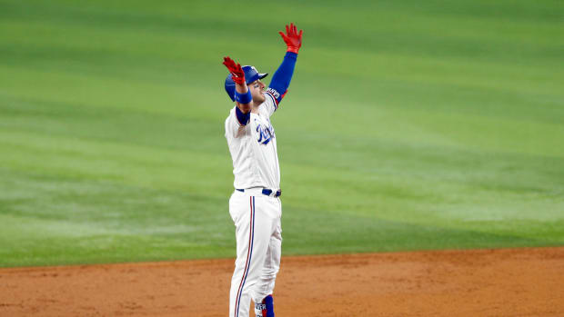 Oct 10, 2023; Arlington, Texas, USA; Texas Rangers catcher Mitch Garver (18) celebrates after hitting a two run double in the second inning against the Baltimore Orioles during game three of the ALDS for the 2023 MLB playoffs at Globe Life Field. Mandatory Credit: Andrew Dieb-USA TODAY Sports